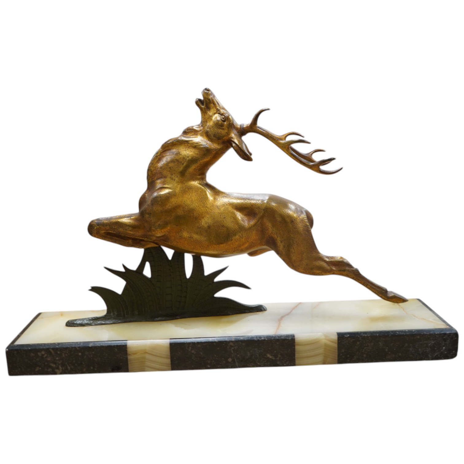 A French Bronze stag attributed to E Guy, on onyx base, 53cm wide x 33cm high